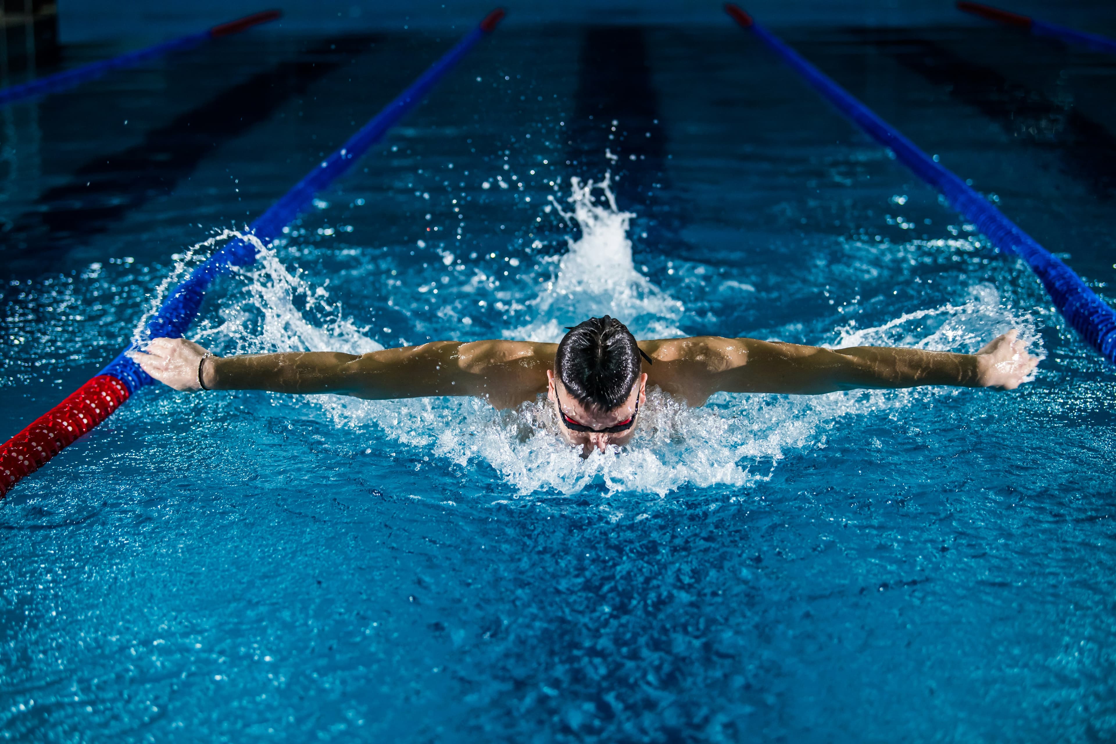 Elite competitive swimming demands a combination of explosive power, stroke efficiency, and aerobic capacity that takes years to fully develop